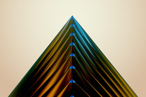 A handmade Christmas tree made of colored paper, adorned with bright decorations, symbolizing holiday cheer