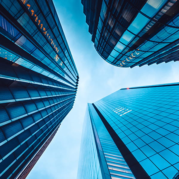 Worms eye view of three buildings